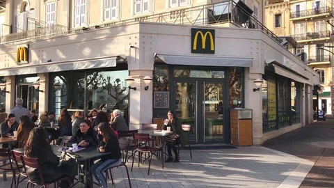 People sitting in an outdoor McDonalds Stock Video Pond5