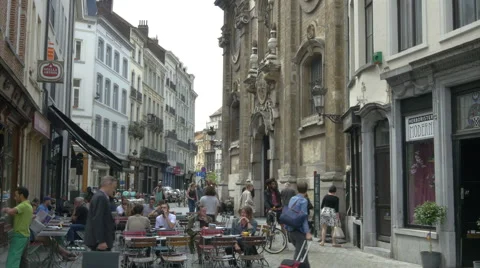 People sitting outside at a cafe - Brussels Belgium Stock Footage 54889372