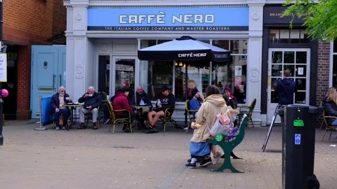 People Sitting Outside Caffe Nero Relaxing Drinking Coffee Video stock 163235815