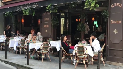 People sitting at Paris cafe Stock Footage 77351767