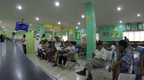 People sitting in queue in government office Stock Footage 54568213