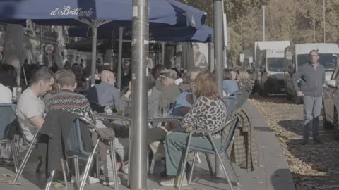 People sitting at a roadside café in Madrid, Spain Stock-Footage 345029407