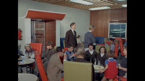 People sitting in room and drinking drinks, United Kingdom, 1967 Stock Footage 139242519
