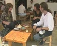 People sitting round table talking and laughing SD Footage