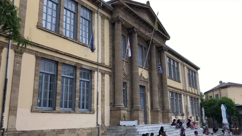 People Sitting at the steps of An Old Building in Nicosia Video stock 90745816