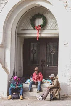 People sitting on stoop Stock Photos