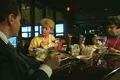 People sitting together eating and talking Footage