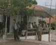People sitting together as prayer call plays nearby SD Footage