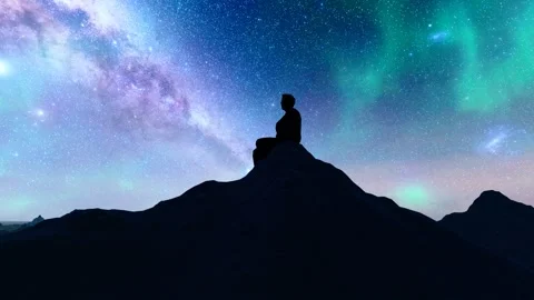 People sitting on the top of the mountain looking up at the stars Stock Footage 259449042