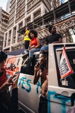 People sitting on the top of the van while Huge crowd of Black Lives Matters Stock Photos