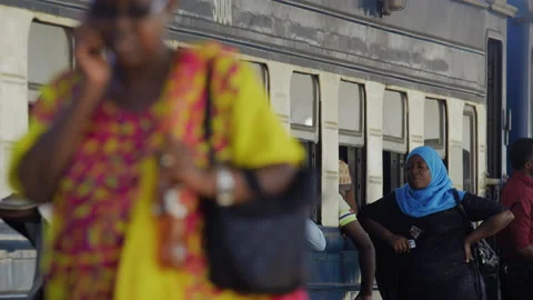 People sitting at the train window  at the train station.DaresSalaam Tanzania Stock Footage 131826793