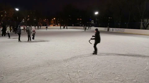 People skate on the outdoor ice rink Stock Footage 59142671
