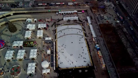 People Skating by Clock Tower in Downtown Toronto, Wide Aerial Reveal Video stock 123831082