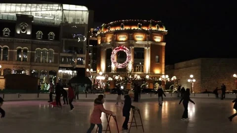 People Skating in Evening in the Old Quebec Stock Footage 294640981