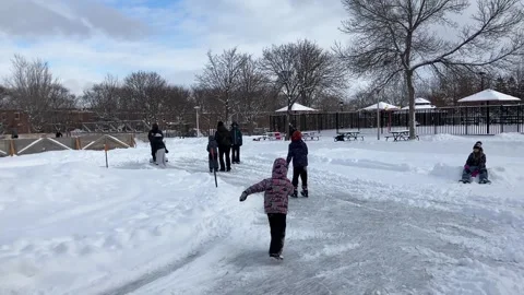People skating on an public ice ring Stock Footage 325078423
