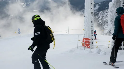 People skiing above the clouds Stock Footage 170011072