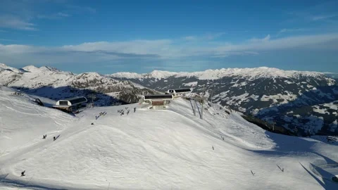 People Skiing Down Mountain Slopes at Ski Resort in Mayrhofen, Tyrol, Austria Stock Footage 334784719