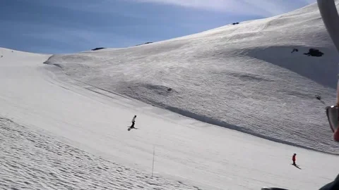 People skiing down slope, arial shot, ski lift chairs, French Alps Stock Footage 101438728