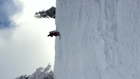 People skiing down by slope Stock Footage 164095350