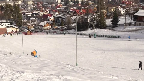 People Skiing on Mountain Resort Slopes Stock Footage 296820331
