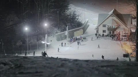 People skiing at night Stock Footage 46034292