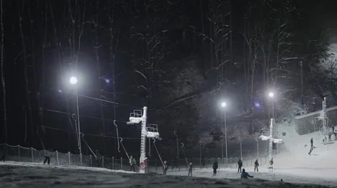 People skiing at night Stock Footage 46034307