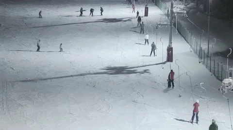 People skiing at night Stock Footage 46034317