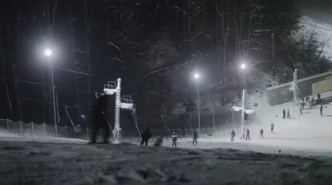 People skiing at night Stock Footage 46034319