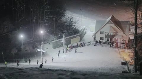People skiing at night Stock Footage 46034329