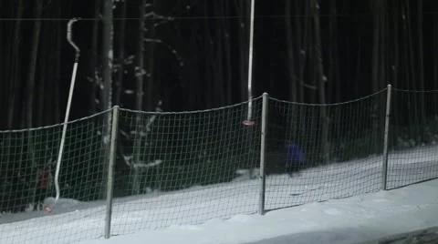 People skiing at night Stock Footage 46034379