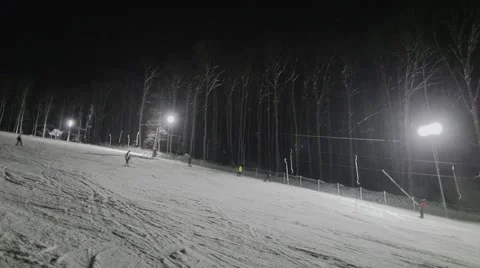 People skiing at night Stock Footage 46034448