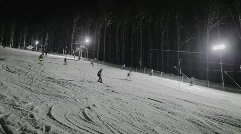 People skiing at night Stock Footage 46034458