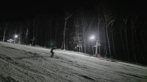 People skiing at night Stock Footage 46034465
