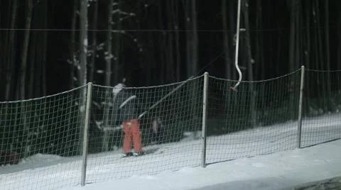 People skiing at night Stock Footage 46034590