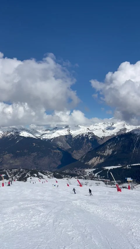 People skiing on the slopes of Courchevel ski resort by winter Stock Footage 337092076