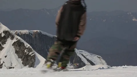 People skiing on snowboards Stock Footage 73353581