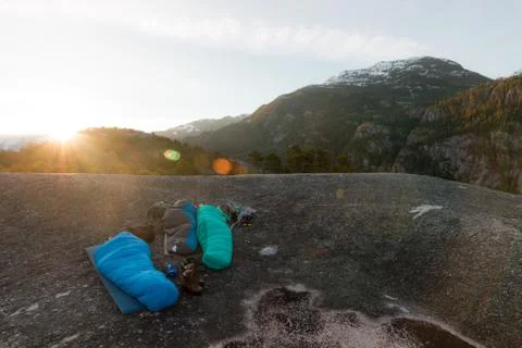 People sleeping on the top of mountains while sunrise Stock Photos