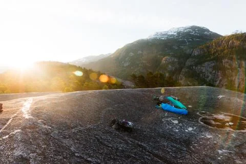 People sleeping on the top of mountains while sunrise Stock Photos