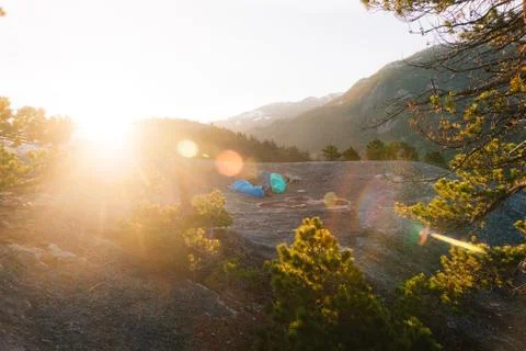 People sleeping on the top of mountains while sunrise Stock Photos
