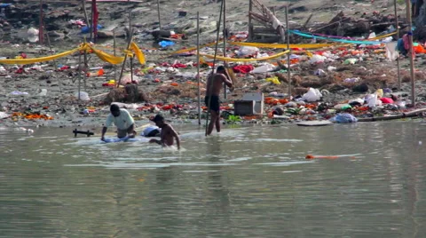 People from the slums bathe in the river. Assam. India Stock Footage