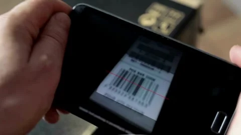 People smart phone scanning barcode printing on grocery list receipt from Cash 動画素材 334644705