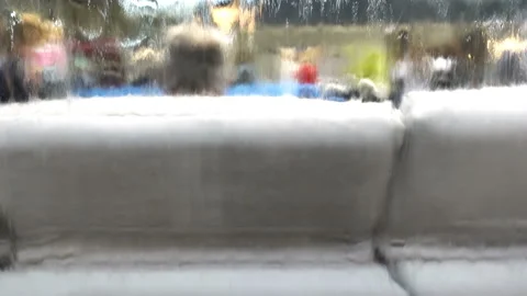 People on sofas and flowing water from a fountain in 4K Stock Footage 152465564