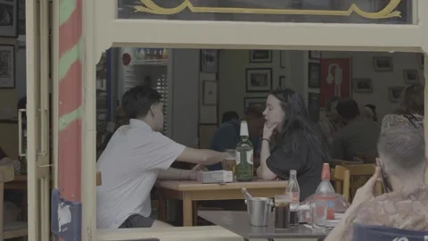 People spending time at a café-bar in Buenos Aires, Argentina Stock-Footage 345141902