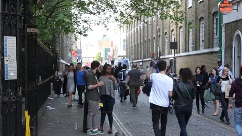 People spending the weekend on Brick Lane Stock Footage 166366761