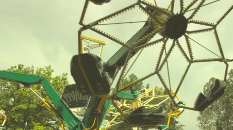 People spinning on a large carousel in the park Stock Footage 51697009