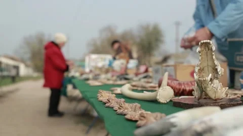 People Spread Gift Items Sets of Various Bones and Things on the Table Stock Footage 62509152