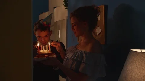 People stand with a cake in the dark. Stock Footage 116538057