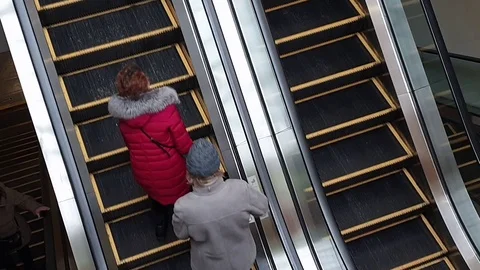 People stand on the escalator Stock Footage 104489252