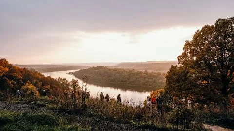 People stand on the observation deck on the mountain in autumn and watch the  Stock Photos