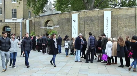 People stand in a queue at the exhibition. Video stock 62064009